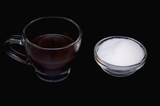 Cup of Coffee and sugar on a black background