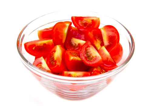 Slices of tomato on bowl on white background