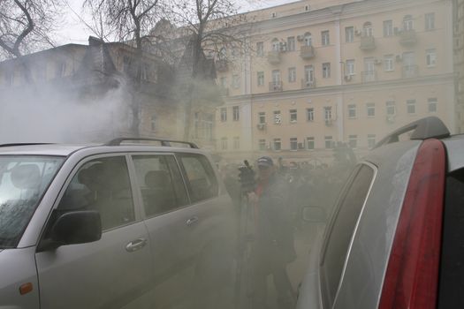 Moscow, Russia - April 19, 2012. Opponents of Pussy Riot sprayed gas among crowd of supporters of the arrested muzakant, the audience near court. . Near the building of the Khamovniki court to an unauthorized action there were supporters of the verdict of not guilty for arrested