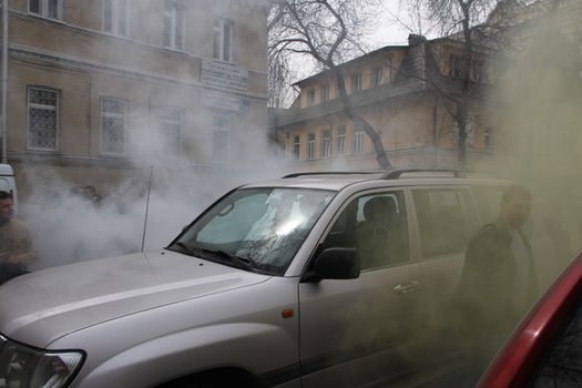 Moscow, Russia - April 19, 2012. Opponents of Pussy Riot sprayed gas among crowd of supporters of the arrested muzakant, the audience near court. . Near the building of the Khamovniki court to an unauthorized action there were supporters of the verdict of not guilty for arrested