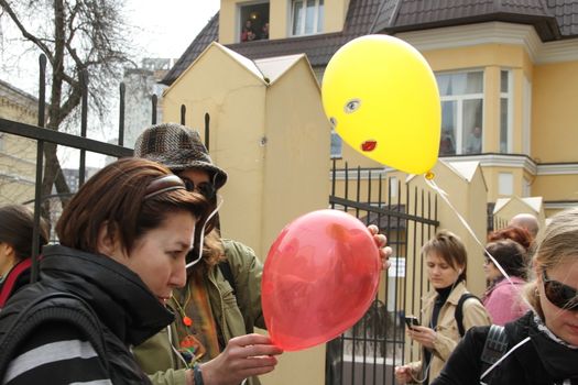 Moscow, Russia - April 19, 2012. Near the building of the Khamovniki court to an unauthorized action there were supporters of the verdict of not guilty for arrested. olitical activists distribute the balloons symbolizing the arrested participants of Pussy Riot