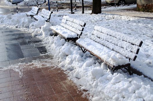Wooden frosted bench in Russe Bulgaria closeup view