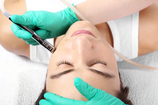 Portrait of a young man groomed during the treatment in the beauty salon