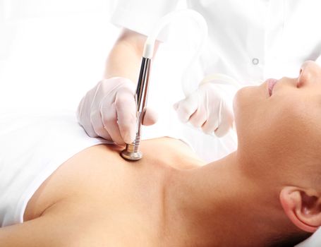 Relaxed woman during a microdermabrasion treatment in beauty salon