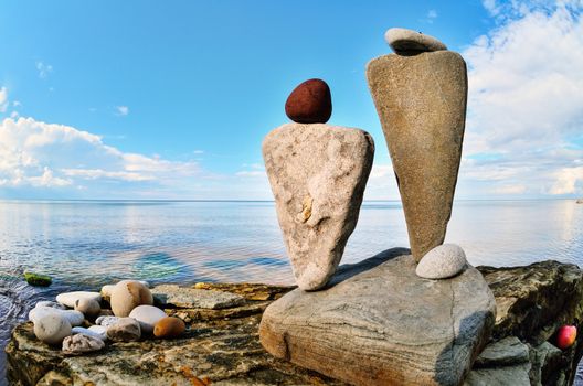 Balancing of two triangle stones on the seacoast