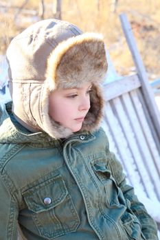 Young boy outside on a cold winters day