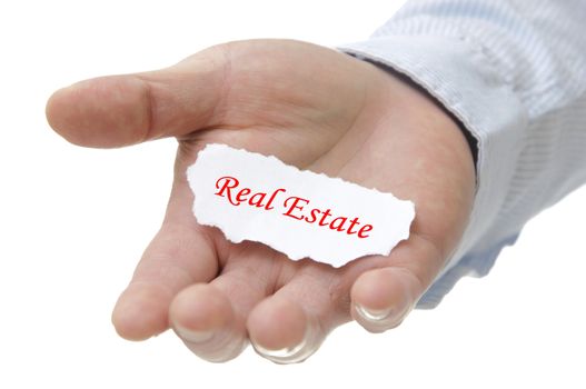 Business man holding real estate note on hand 