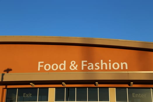 Food and fashion sign on building