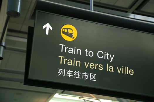 Train to city sign at airport