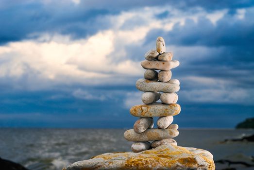 Balancing of stones each other on the seashore