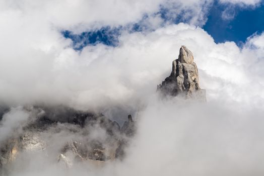 top of the mountain shrouded by clouds