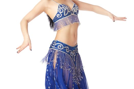 Belly dancer in blue traditional dress on a white background