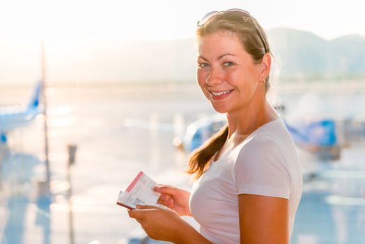 girl with a passport and a ticket waiting for the plane