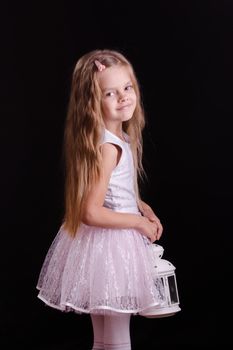 Five year old girl standing with a candlestick