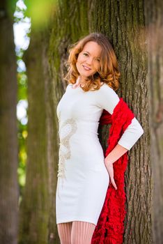 shooting of a young girl in a summer park near the tree