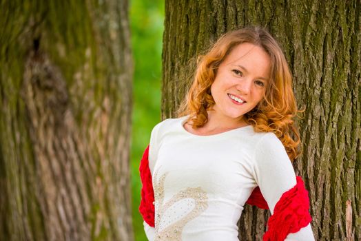 happy girl in a white dress with brown eyes - portrait