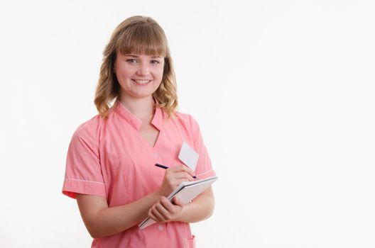 Portrait of a pretty girl medical worker on a white background
