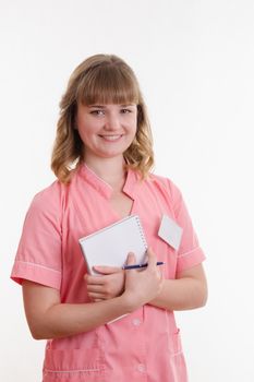 Portrait of a young pretty girl medical worker on a white background