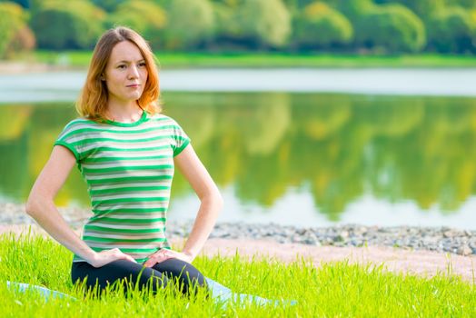 girl in green t-shirt at the lush grass playing sports