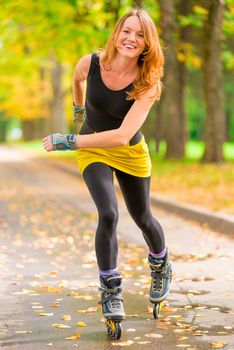 girl athlete fast rides on roller skates