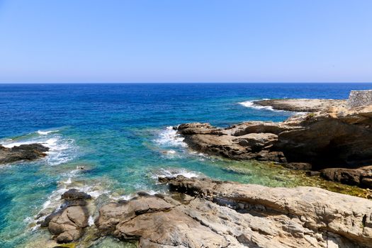 The blue see and rocks of Apollonas in Naxos