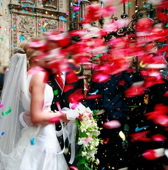 shower of rose petals to a newlywed couple