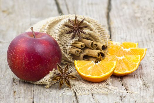 fruits and spises on wooden background