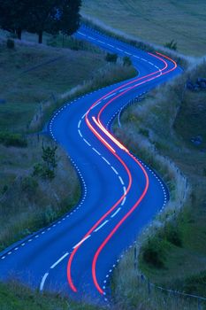 view of traffic on curvy winding road in southern sweden