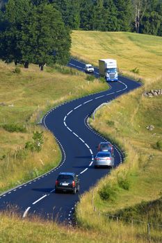 view of traffic on curvy winding road in southern sweden