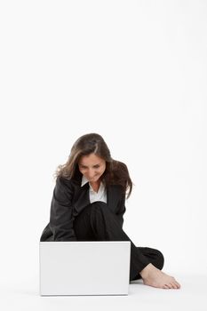 attractive young businesswoman working with laptop computer smiling