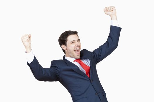 young business executive in suit cheering isolated on white - clipping path