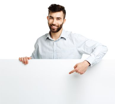 A young bearded man showing blank signboard, isolated over white background