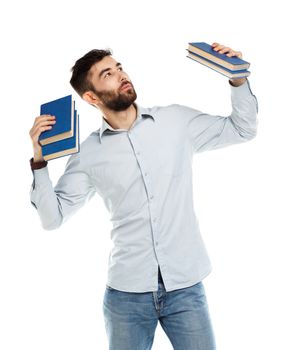 Young bearded smiling man with books in hand on white background