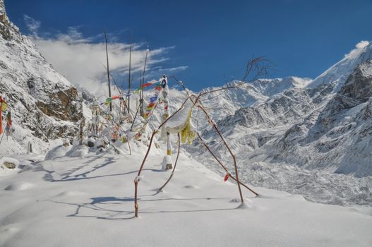 Buddhist prayer flags in Himalyas near Kanchenjunga, the third tallest mountain in the world