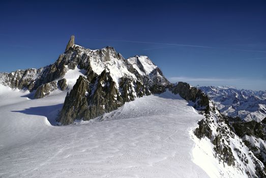 Breathtaking view of snowy mountains from the top in Valle Blanche
