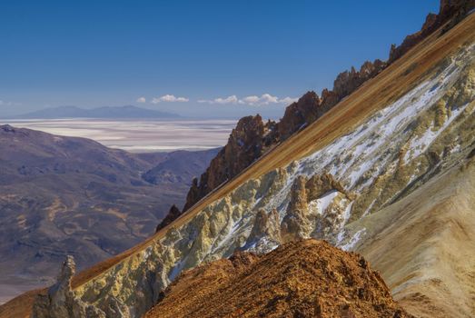 Scenic view of colored mountain slopes above Salar de Uyuni in Bolivia