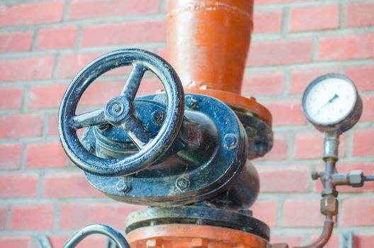 At the Landscape Park Duisburg Nord. 
The former blast furnace in Duisburg Gemany was closed in 1985 and opened to the public. 
Here iron pipe with shutoff valve and flange.
