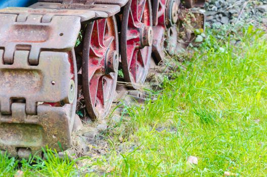 Detail of an old rusty tracks, tanks, chain landing gear.