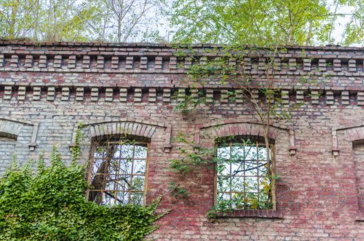 Abandoned factory building. Crumbling Einstürzende brick wall, old mortar joints.