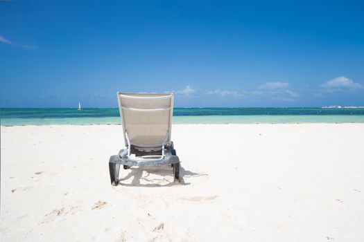 Lonely sunbed on Caribbean Beach