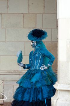 The blue lady in the carnivalesque costume  and venetian mask