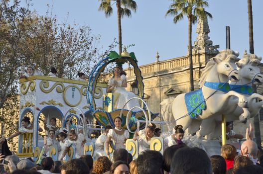 The Cavalcade of Magi, traditional parade of kings coaches in street, in Seville, Spain. The Magi (Melchior, Gaspar, and Baltasar) ride through the streets, as their page boys throw candies to children. 
