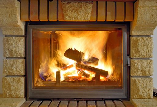 Roaring flames in a modern fireplace