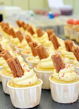 Cupcakes with Chocolate bar on table