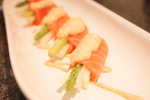 Salmon mentai sauce  on white plate, stock photo