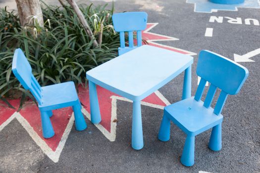 Blue chairs and table Made from plastic Located on the corridor