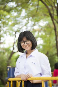 Portrait of Asian schoolgirl Smiling a happy in the park.