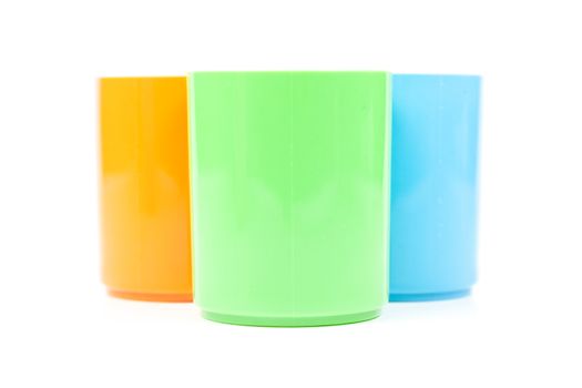 colorful variety of plastic cups. Isolated white background. plastic cups, taken within the studio.