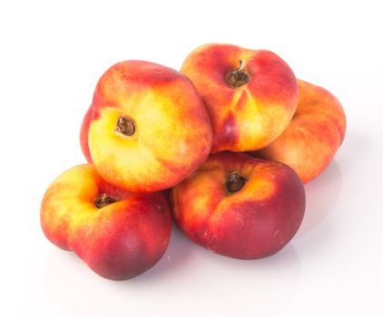 donut peaches. flat peaches on the background