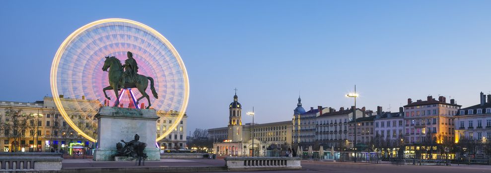 Famous Place Bellecour statue of King Louis XIV by night, Lyon France 